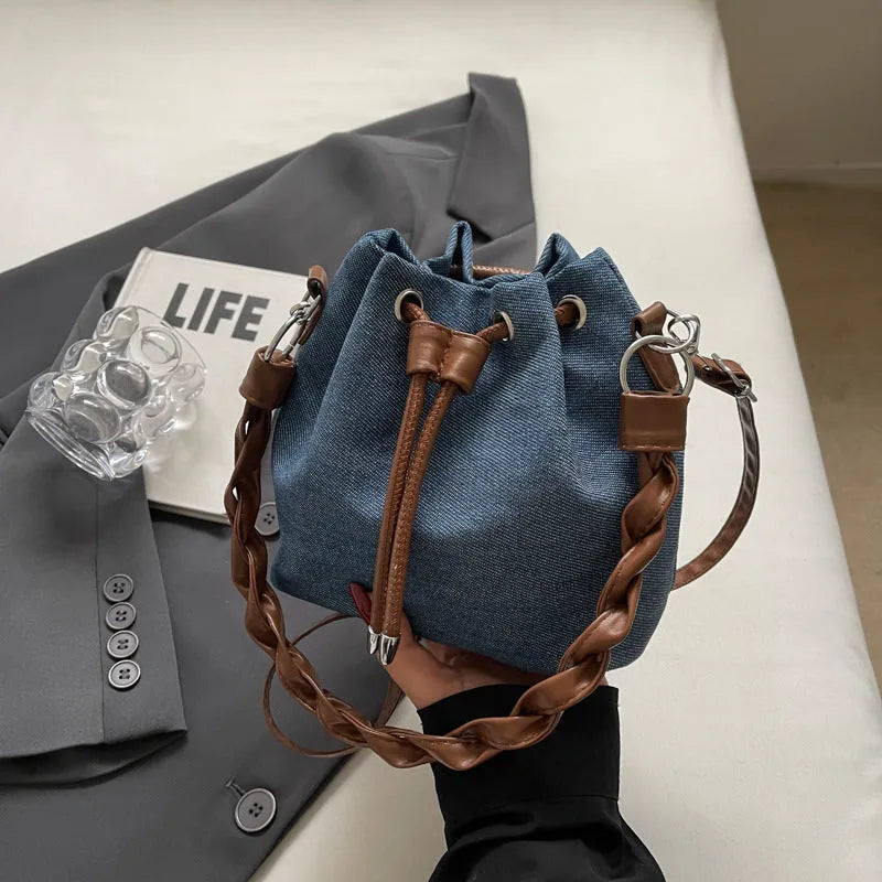Blue synthetic leather cross body bucket messenger bag with sandwich pocket design