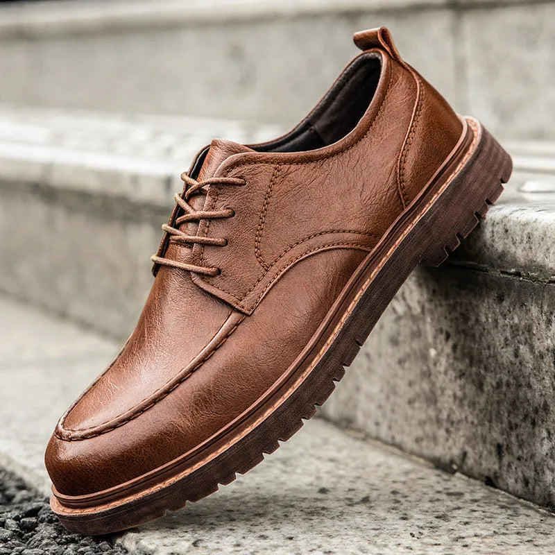 Men's brown casual leather slip-on shoes with round toe and flat rubber sole