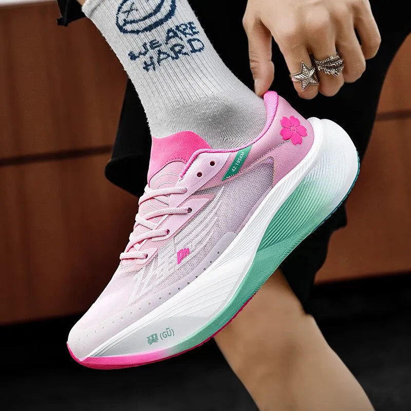 Low-top racing sneaker with carbon plate technology in Glacier colour, showing front lace-up design.