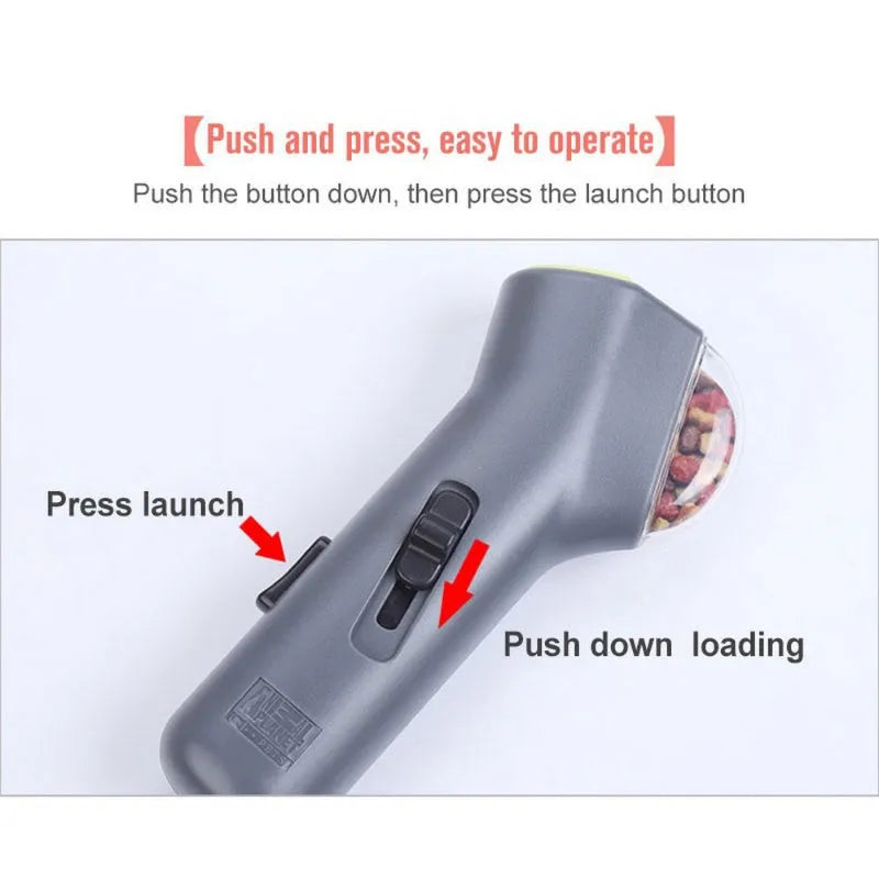 Grey plastic pet snack catapult launcher toy on a plain background.