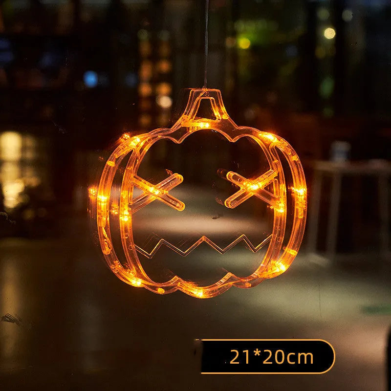 Set of seven battery-powered Halloween LED hanging lights with ghost, spider, and pumpkin designs for window decoration.