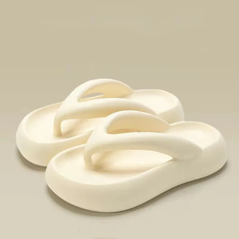 Solid colour thick-soled flip flops with decorative bow and injection moulded EVA construction