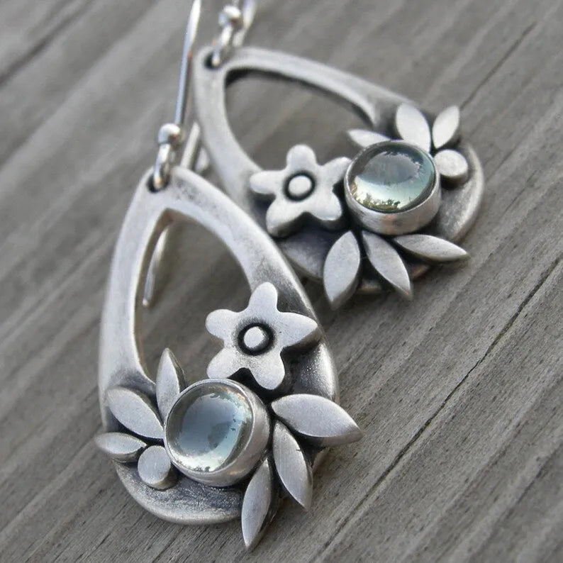 Silver alloy drop earrings with teardrop floral and leaf design