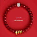 Handmade cinnabar snake zodiac bracelet with roll beads, shown in Chinese style.