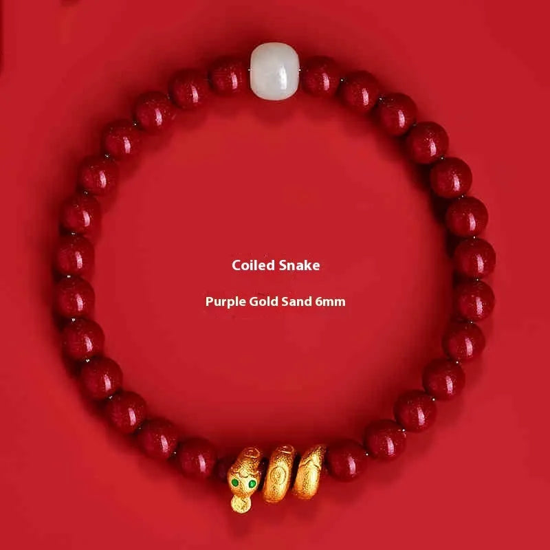 Handmade cinnabar snake zodiac bracelet with roll beads, shown in Chinese style.