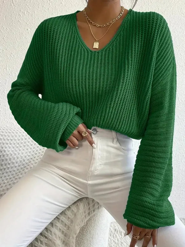 Women's solid colour long sleeve pullover top in polyester, shown in available colours.