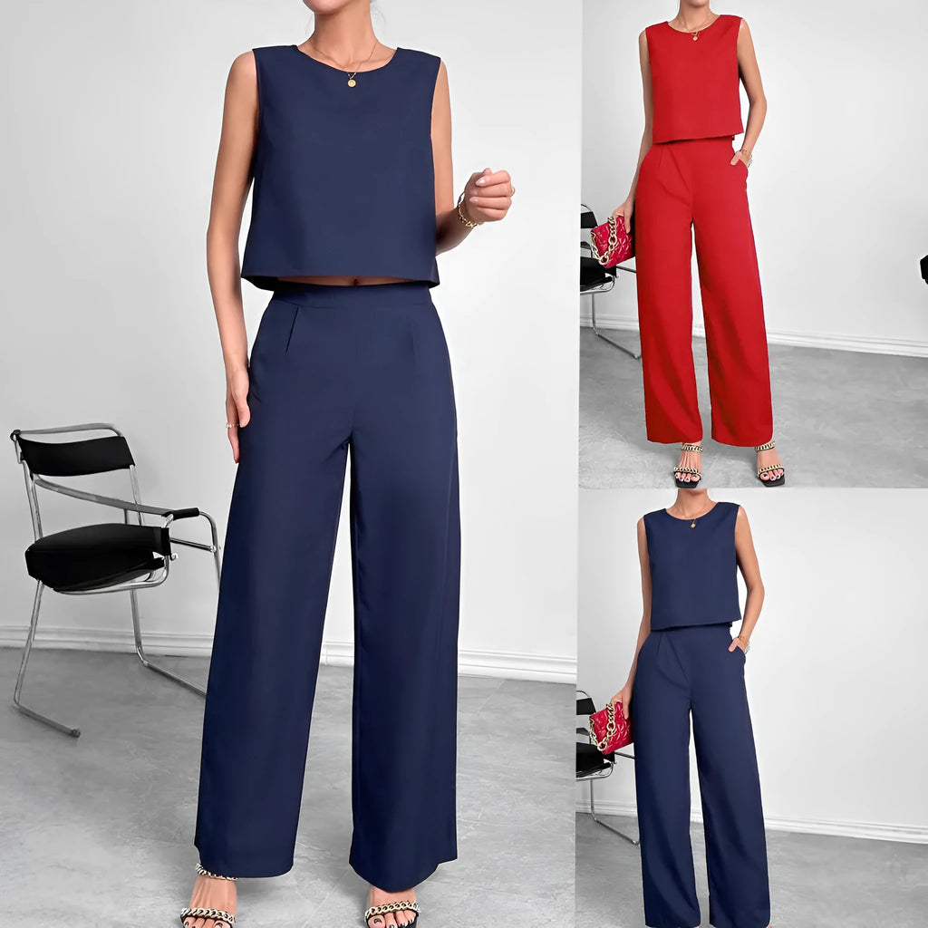 Red two-piece set with sleeveless round neck top and wide-leg trousers laid flat