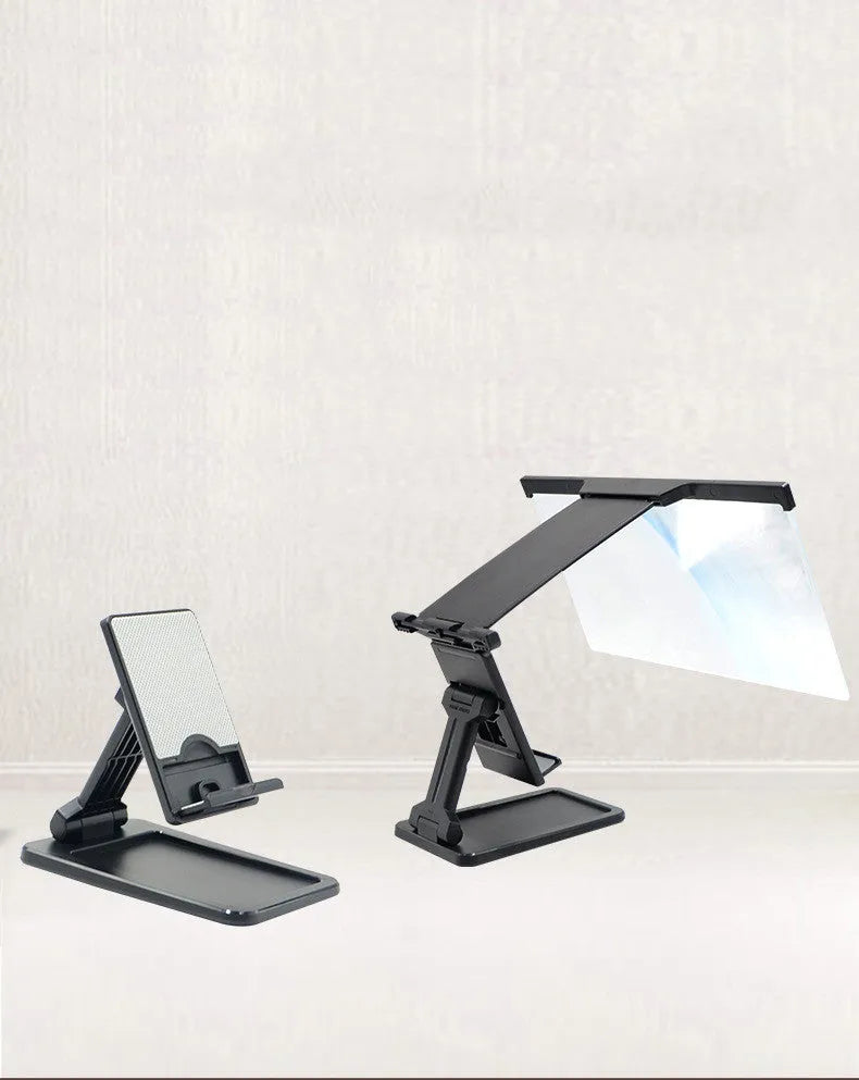 Black folding mobile phone screen magnifier with detachable holder on a desk