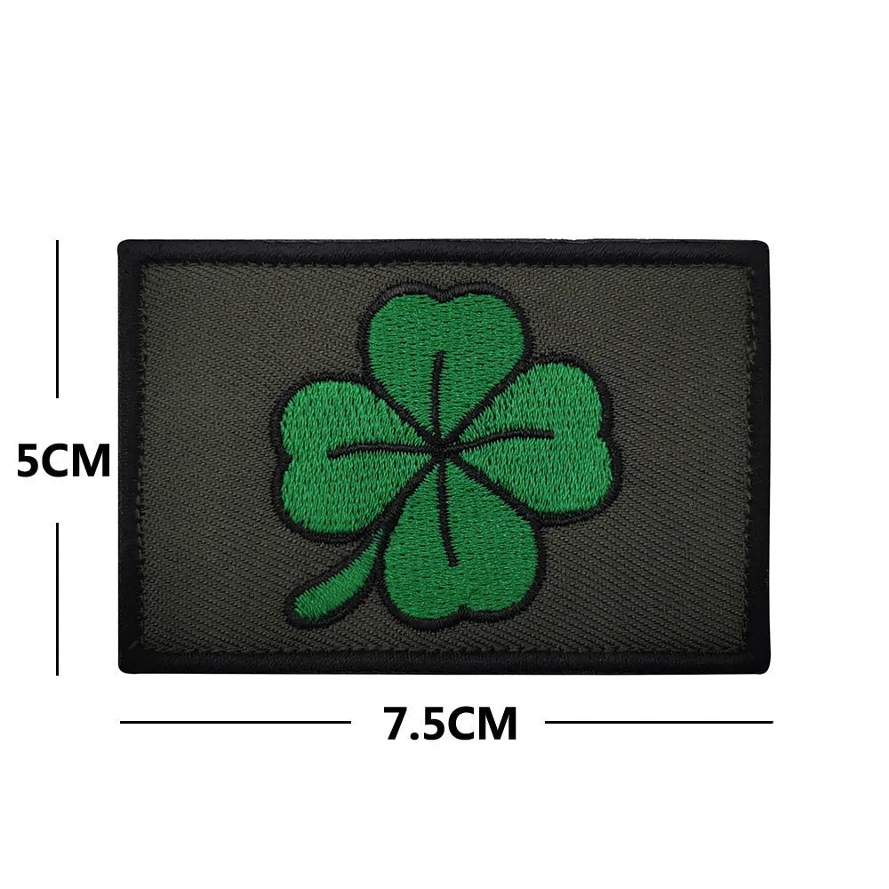 Outdoor embroidered fabric badge with Velcro backing on a tactical vest.