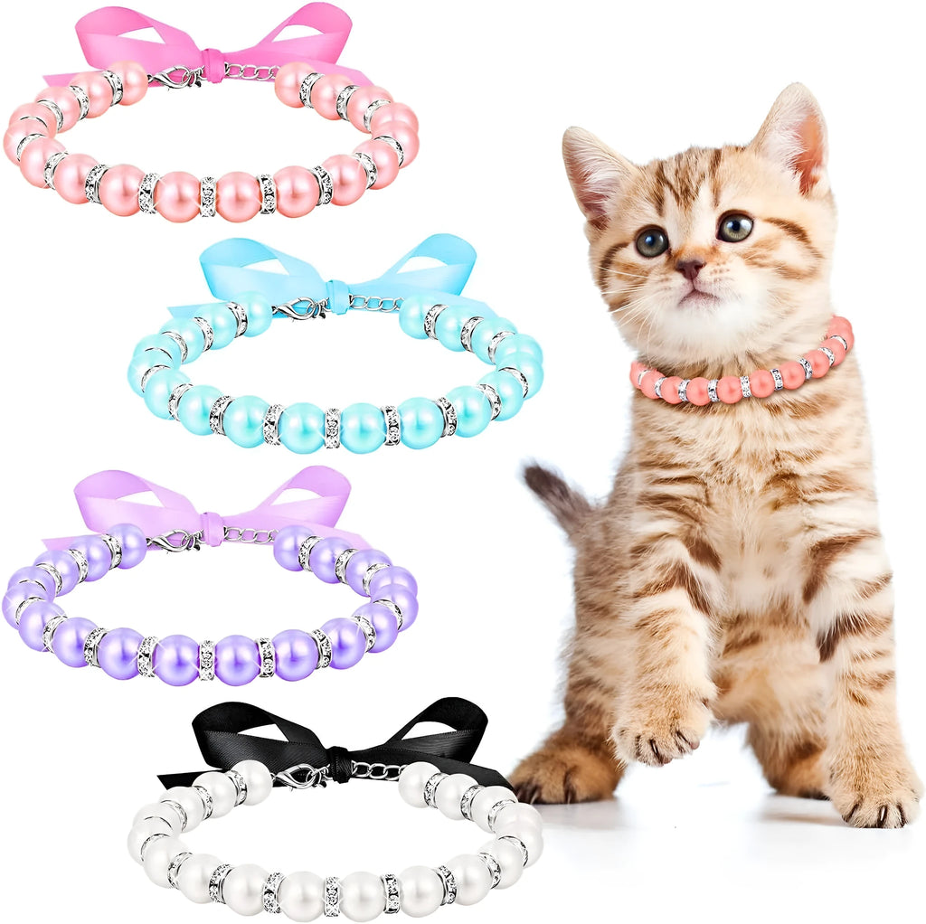 Small dog wearing blue imitation pearl and rhinestone necklace with adjustable clasp and ribbon bow