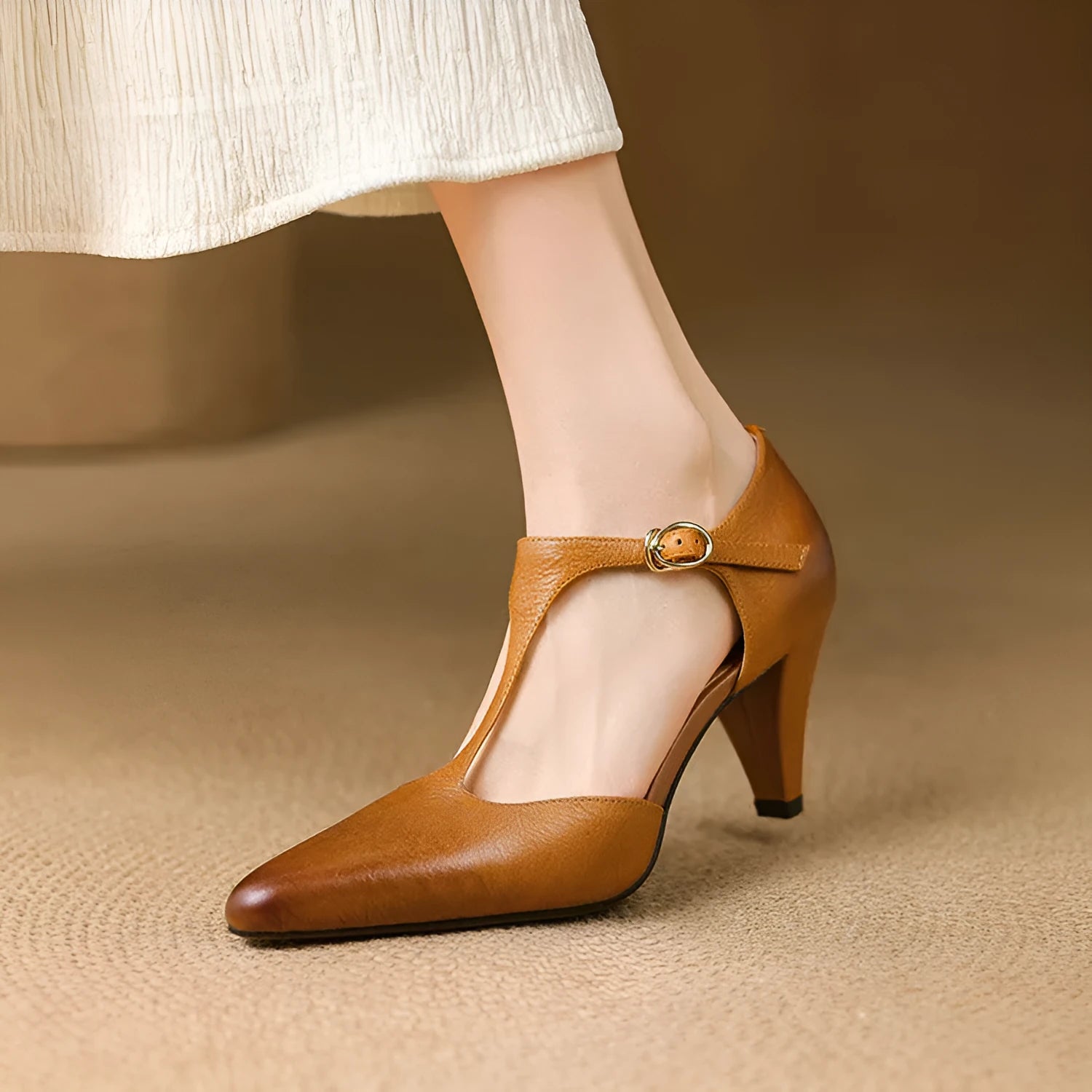 Brown women's retro sandals with a T-strap buckle and a short stout heel.