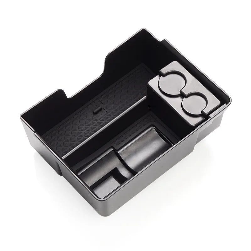 Plastic storage box designed for retrofitting into a Tesla Model 3, S, or X central control armrest.