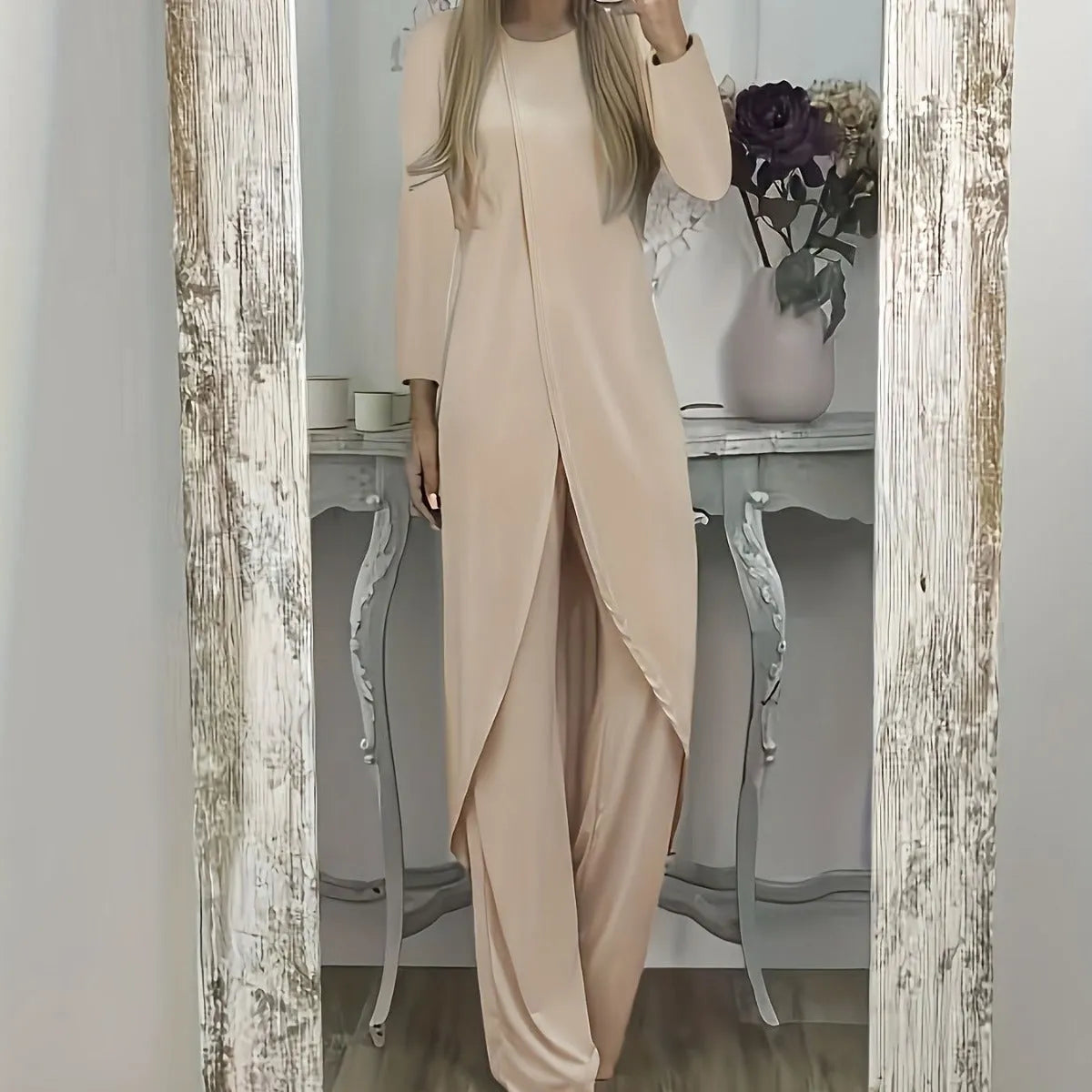 Casual loose-fitting long sleeve top and trousers lounge set in polyester.
