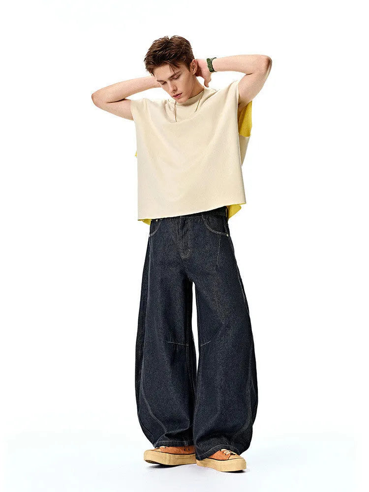 Men's wide leg denim trousers in original cow colour showing full length and relaxed fit