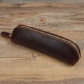 Square leather pencil case with zipper closure in black, brown, dark brown, or yellow colour