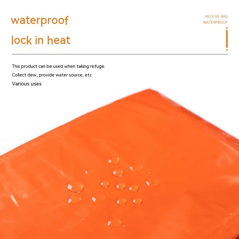 Orange portable disaster relief tent kit with sleeping bag, raincoat, and emergency blanket packed together.