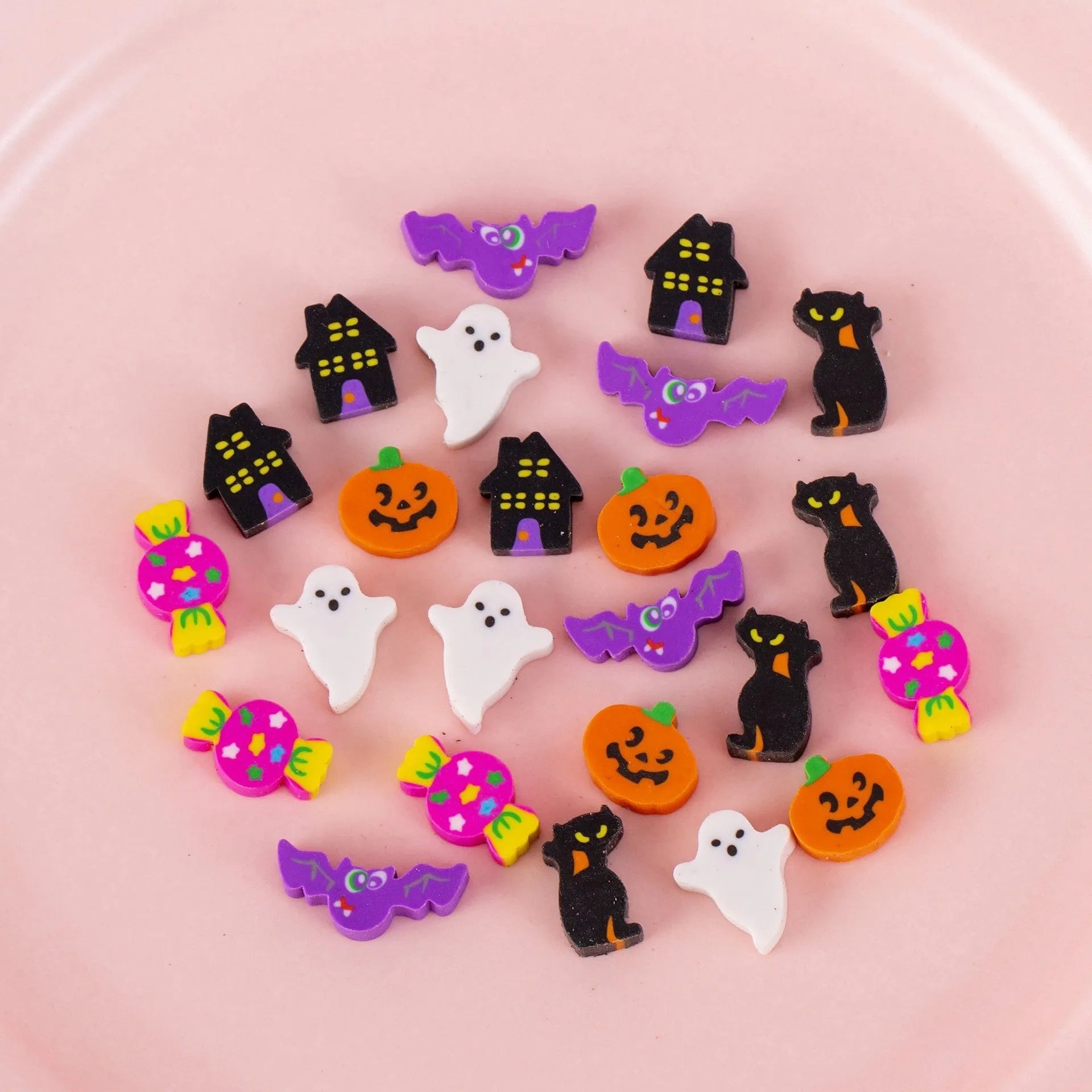 50 colourful cartoon mini erasers in shapes of fruits, animals, and cakes, displayed next to a pearlescent film bag.