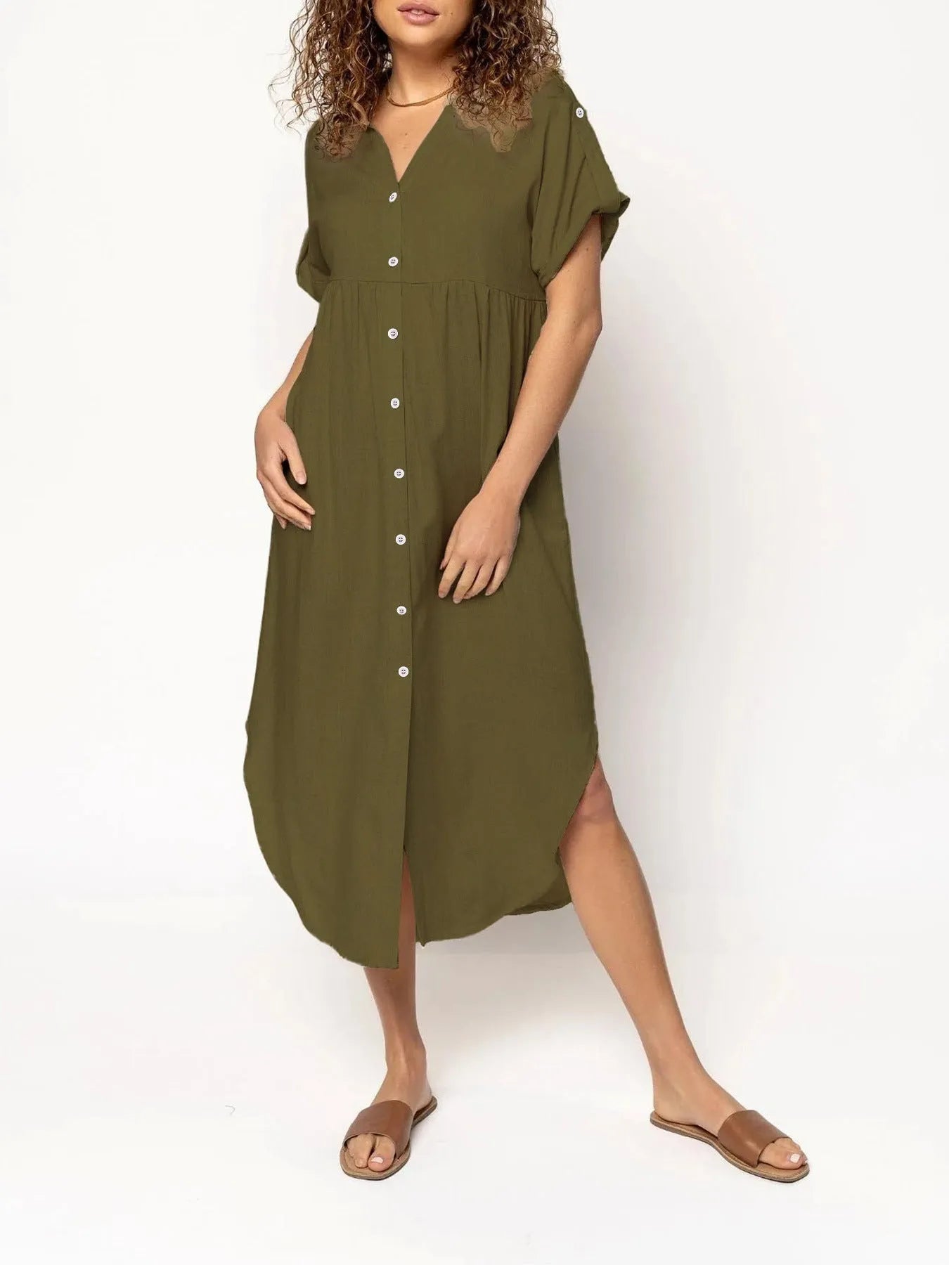 A loose-fitting, solid colour mid-length casual dress with a button-down front and regular sleeves.