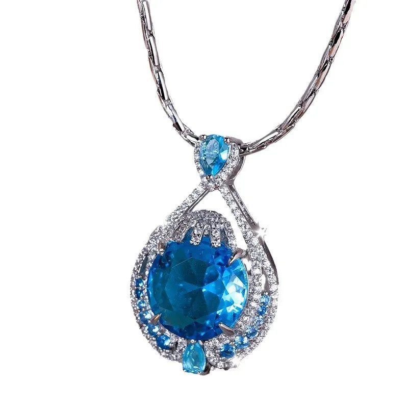 Blue geometric crystal pendant necklace with fireworks cut design on water wave chain