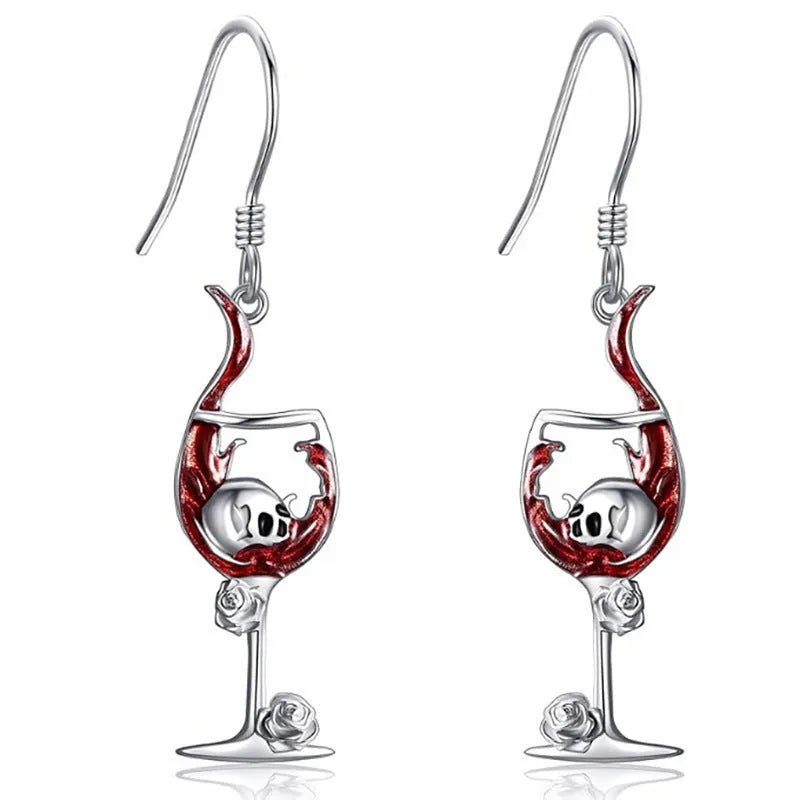 A pair of metallic geometric skull wine glass earrings for women, shown in dark gothic style.
