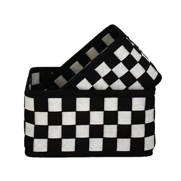 Grey and white checkerboard woven folding felt storage basket showing collapsible design