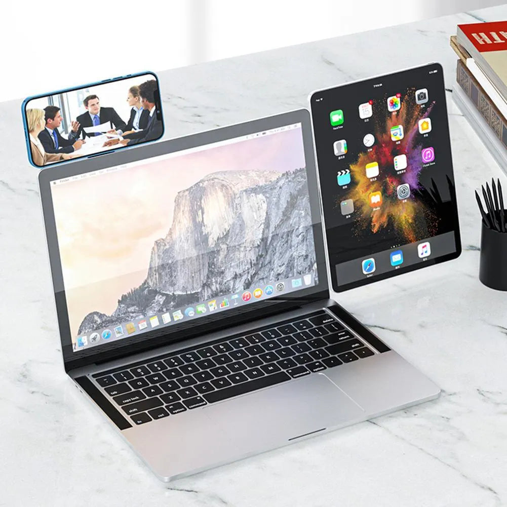 Black aluminum laptop phone holder with magnetic mount attached to computer monitor