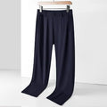 Men's black ice silk loose straight-leg casual trousers with elasticated waist on a plain background.