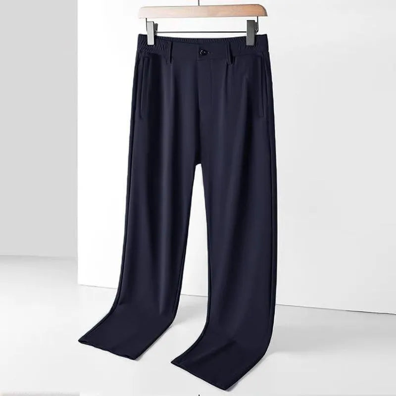 Men's black ice silk loose straight-leg casual trousers with elasticated waist on a plain background.