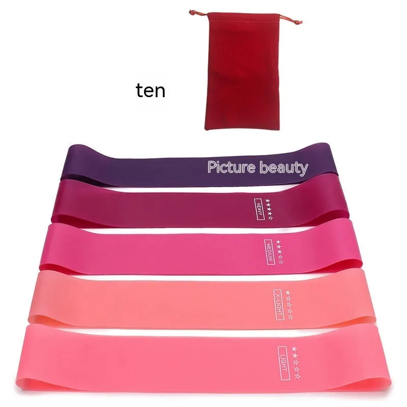 Five colour-coded TPE yoga tension straps with graduated thickness for resistance training
