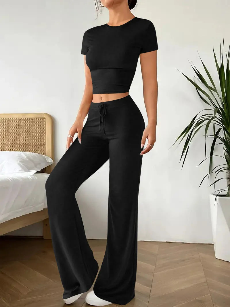Black high waist polyester trousers with matching short sleeve t-shirt top women's suit set