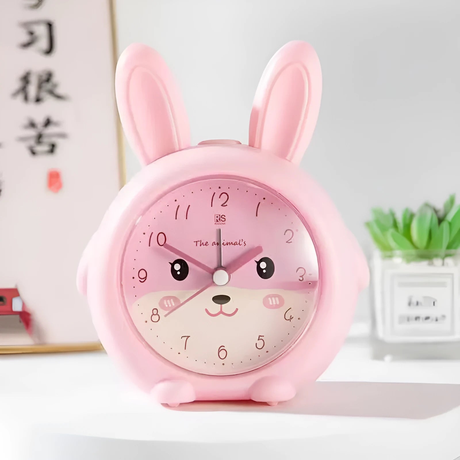 Cartoon style children's alarm clock with pink or blue colour and multiple functions