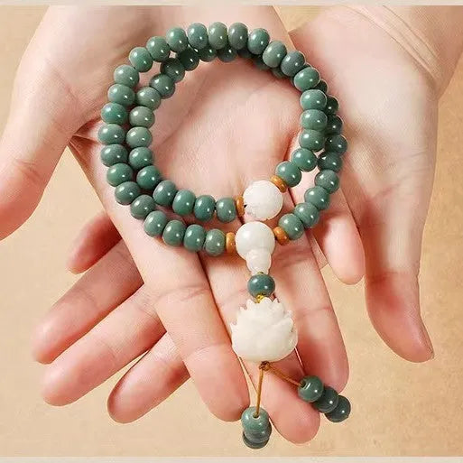 White jade and bodhi seed beaded bracelet with a double ring safety buckle clasp.