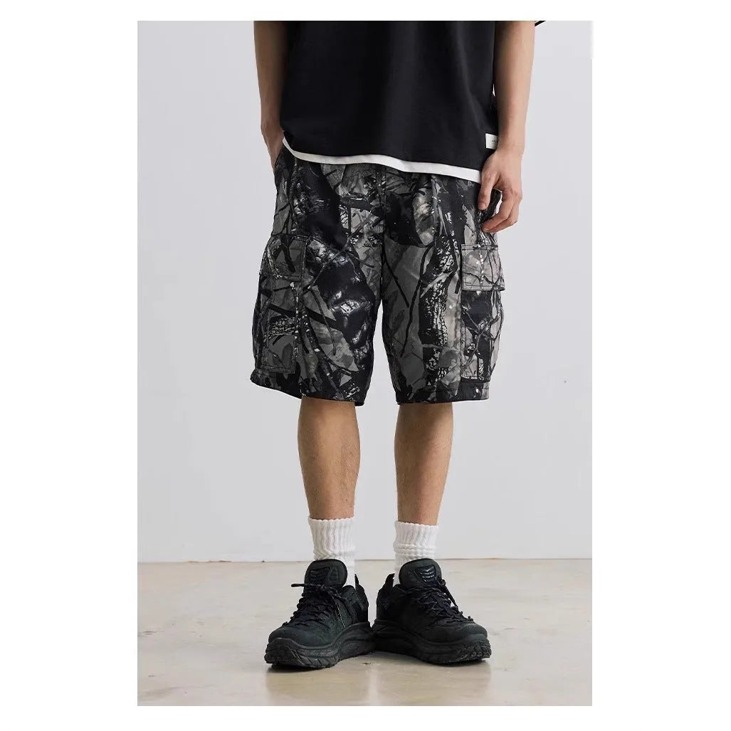 Straight-leg denim shorts in black or army green with mid-waist design and zip fly