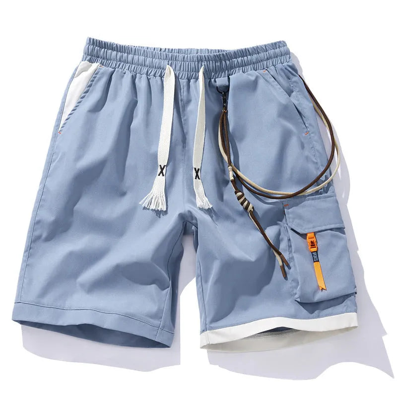 Man wearing loose-fitting black bamboo fibre sports shorts with a straight-leg cropped cut.