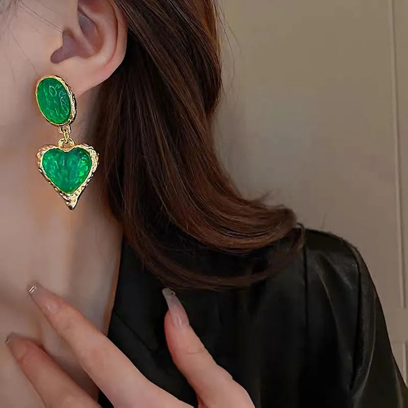 Silver needle pleated oval love heart stud earrings in alloy, showing green, purple, red, and yellow and white colour options.