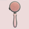Double-sided cat brush with release button and flea comb in green and pink colour options