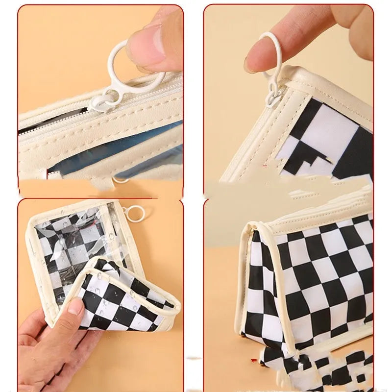 Large transparent PVC pencil case with a chessboard pattern, showing pens inside.