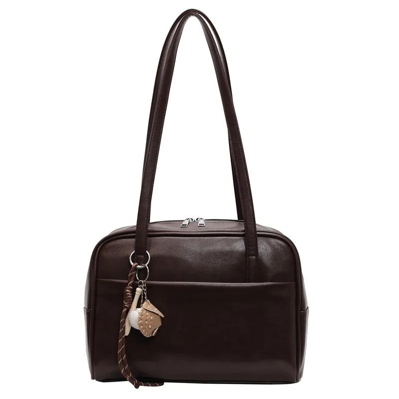 Women's urban simple PU bucket underarm bag with pendant detail in black, brown, coffee, and wine red colours.