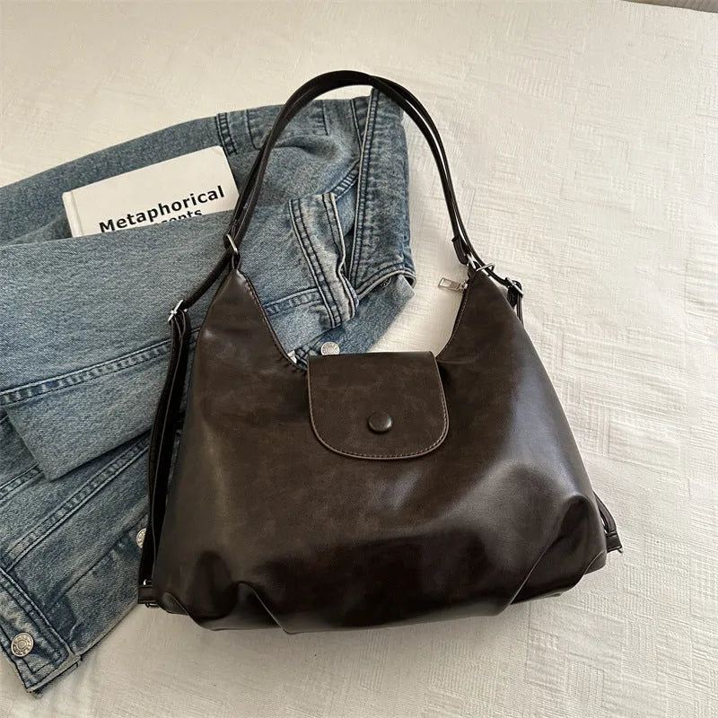 Women's black PU leather horizontal square shoulder bag with single strap and internal phone pocket