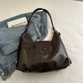 Women's black PU leather horizontal square shoulder bag with single strap and internal phone pocket
