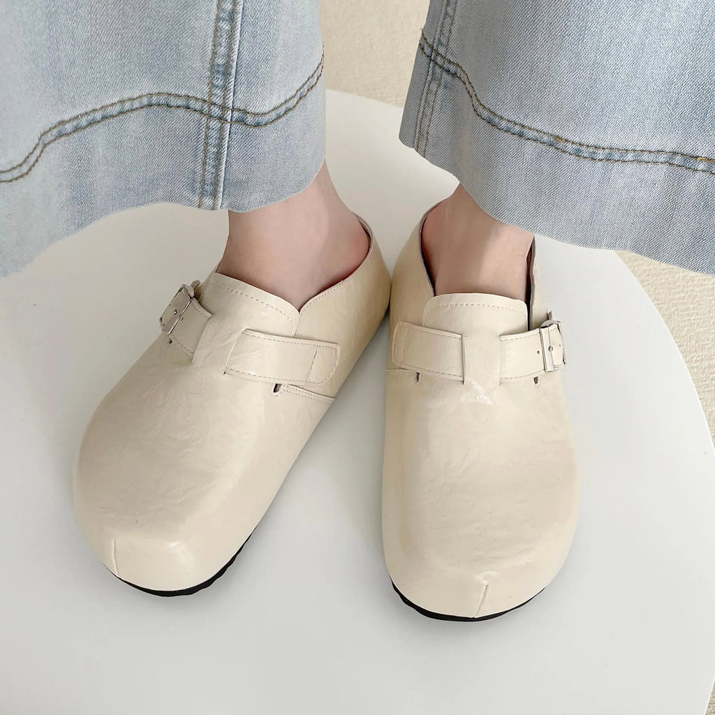 Flat buckle casual sneakers in yellow, black, silver, and creamy-white colours with rounded toe shape