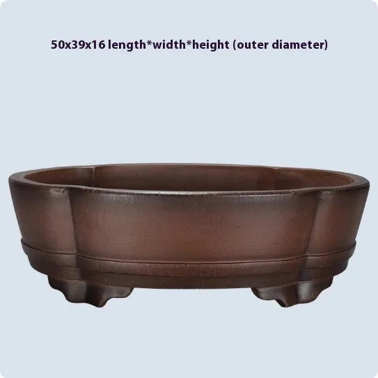 A large, classical-style purple clay flower pot on a wooden floor.