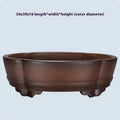 A large, classical-style purple clay flower pot on a wooden floor.