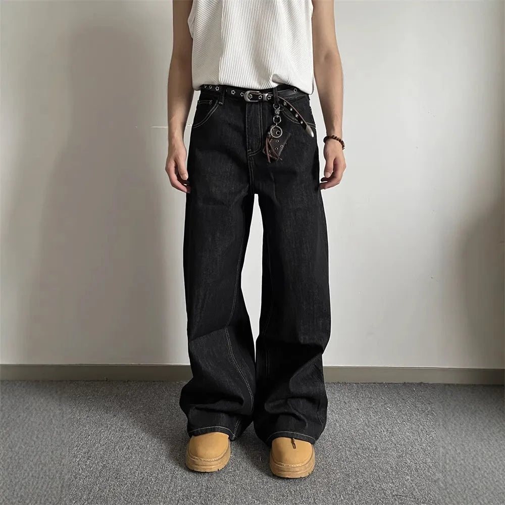 Black loose fit wide-leg denim jeans with a straight leg and mid waist on a hanger.