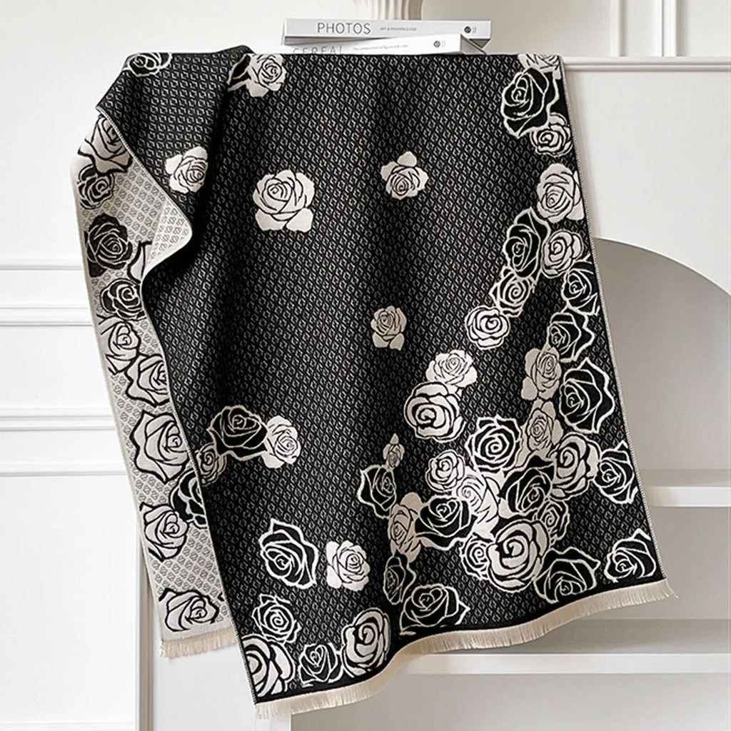 Grey imitation cashmere winter scarf with tassels laid flat, showing its long rectangular shape.