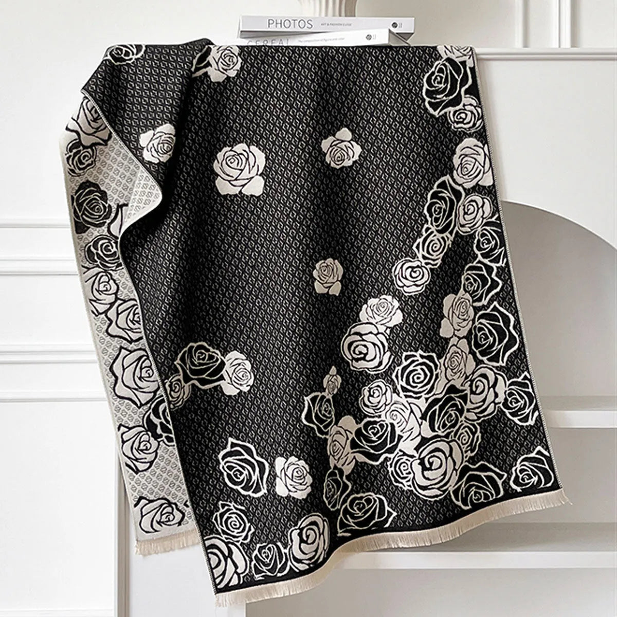 Grey imitation cashmere winter scarf with tassels laid flat, showing its long rectangular shape.