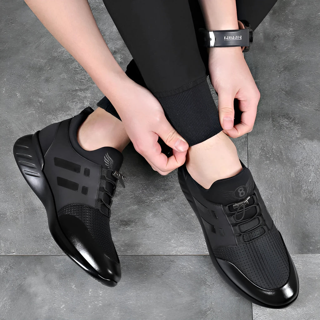 Men's black casual shoes with hidden height increase, showing chunky rubber sole and choice of leather or mesh upper