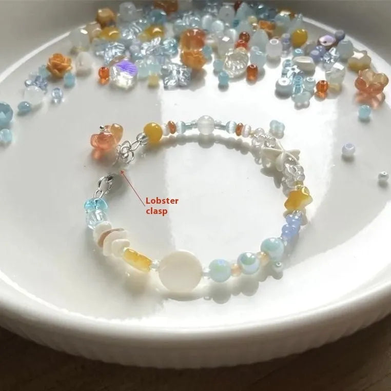 Orange mixed-alloy bracelet with diamond pattern and water-soaked bead seaside design