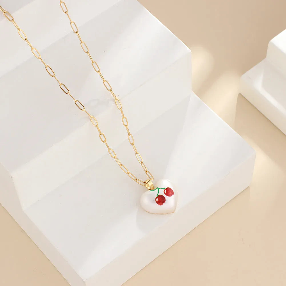 Heart-shaped necklace with a choice of fruit pendant charms on an adjustable chain.