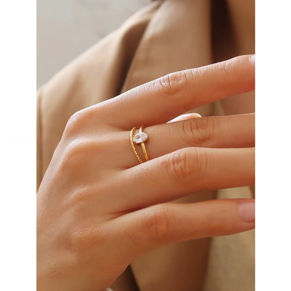 Golden electroplated stainless steel love heart ring showing heart shape design elements
